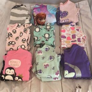 Nine pairs of toddler pajamas